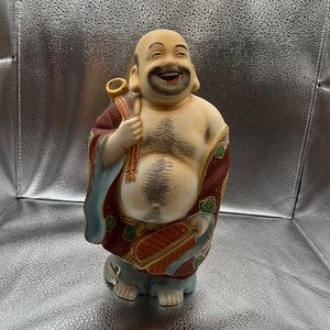 This rare figurine was originally a Sake decanter (empty)